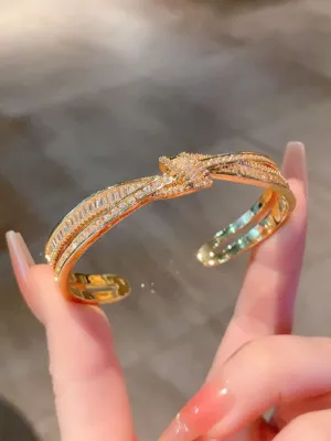 Crystal Bow Bangle Bracelet with Crossed Ribbon Design