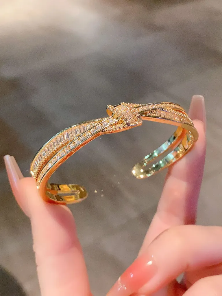 Crystal Bow Bangle Bracelet with Crossed Ribbon Design
