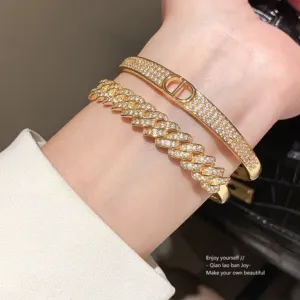 Gold Tone Zirconia Buckle Bangle with Sparkling Chain Detail