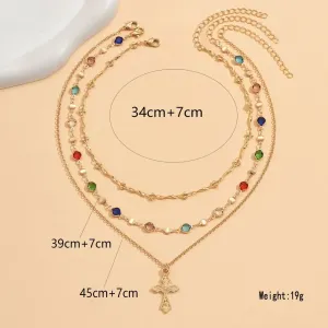 Layered Gold Tone Cross Necklace with Colorful Rhinestone Accents